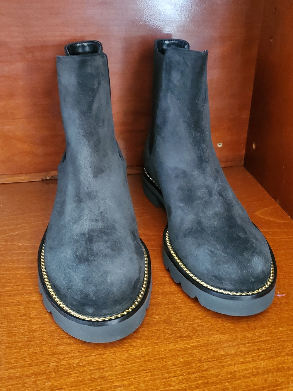 Stuart Weitzman Black Suede Chelsea Booties with Gold Chain Trim